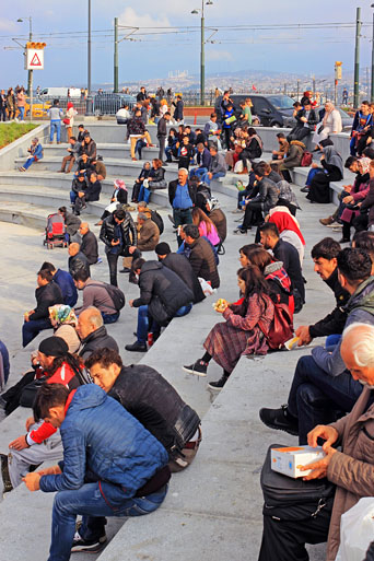 TURKEY, Istanbul, Eminonu Waterfront, people relaxing and chatting, TUR973JPL A 513 deep