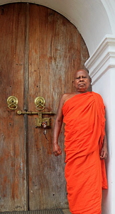 Degaldoruwa Cave Temple (near Kandy), Monk by entrance door, SLK5789JPL