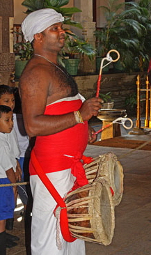 SRI LANKA, Kandy, Temple of the Tooth (Dalada Maligawa), drummer at temple morning opening ceremony, SLK3047JPL copy