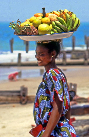 GAMBIA, fruit seller on beach, GAM896JPL A 480 deep