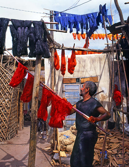 MOROCCO, Marrakesh, Medina (old town), man drying coloured wool, MOR311JPL A 539 deep