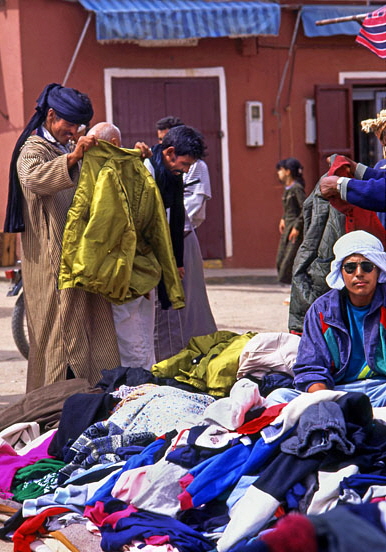 MOROCCO, Tafroute, Souk in mountain village, Berber people trading clothing, MOR378JPL A 552 deep