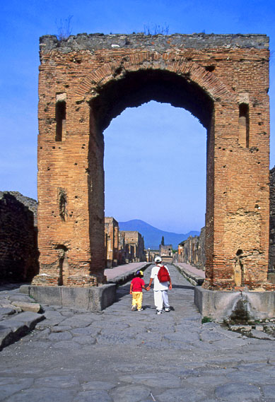 ITALY, Campania, POMPEII, two children along ancient stone paved street, ITL1076JPL  569 deep