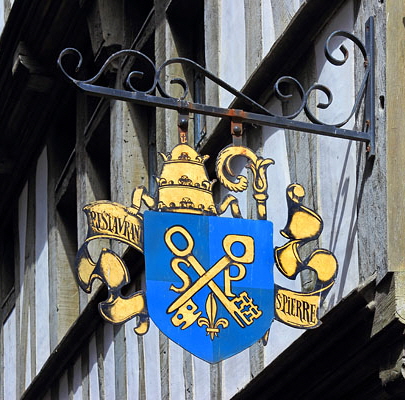 FRANCE, Normandy, MONT SAINT-MICHEL, wrought iron signs on narrow streets, FRA2806JPL A 600