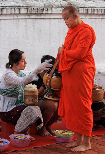 LAOS, Luang Prabang, Alms Giving Ceremony, monk accepting food offerings, LAO249JPL 350