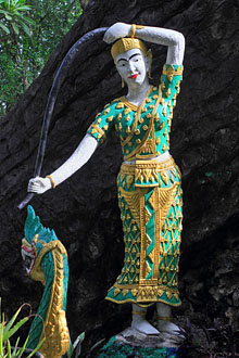 LAOS, Luang Prabang, Phousi Hill, statue of a Goddess wringing water from her hair, LAO195JPL 220