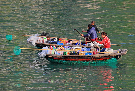 VIETNAM, Halong Bay, boat vendors with snacks for selling to cruise boat tourists, VT1890JPL A 600