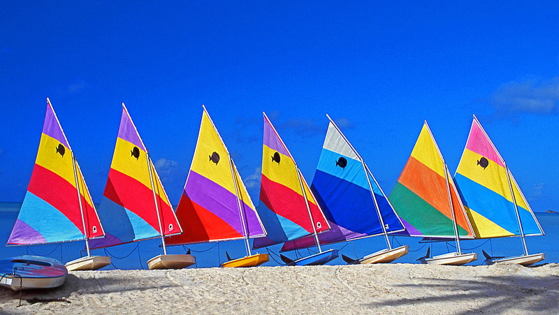 ANTIGUA, West Coast, row of sailboats lined up along beach, ANT759JPL A 800