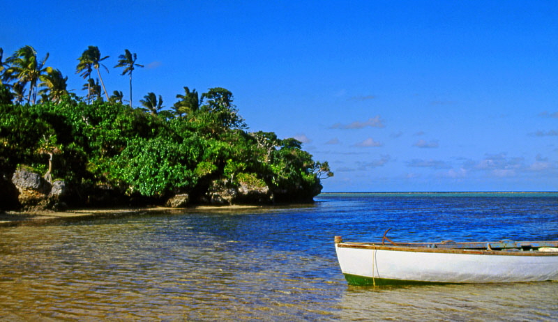 TONGA, Atata Island, coastal view, with small fishing boat, TON2240JPL A 800