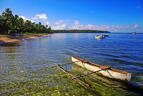 TONGA, Pangaimotu, coastal view, with small fishing catamaran A 380 deep